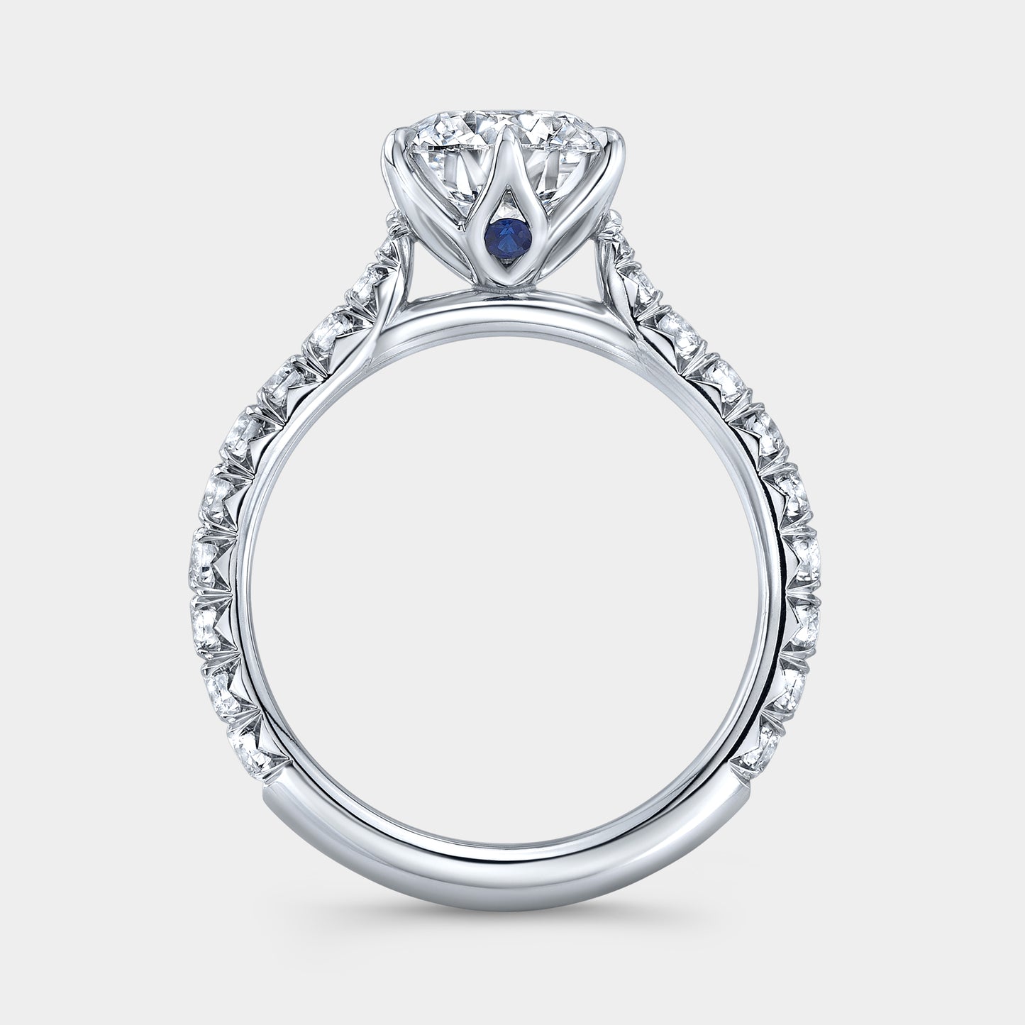 Platinum round ring, tulip pave with hidden gem.