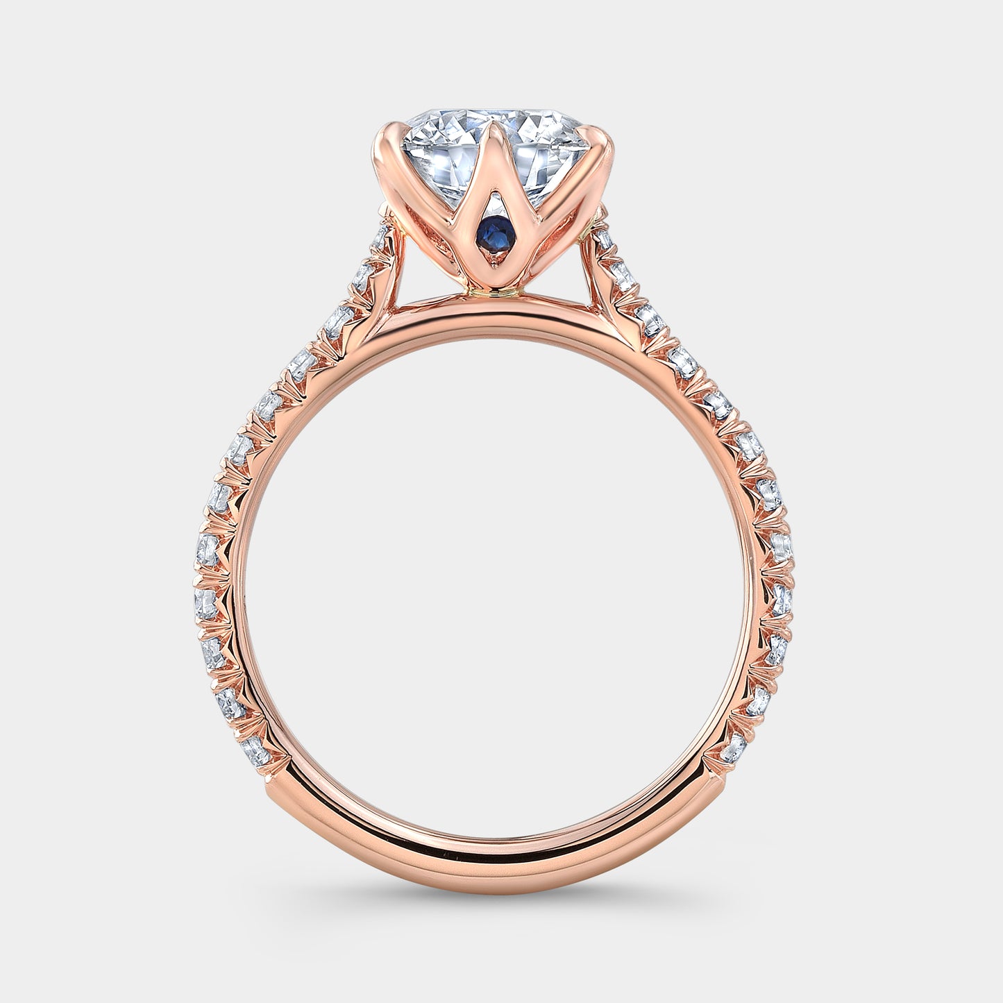 Rose gold round ring, tulip pave with hidden gem.