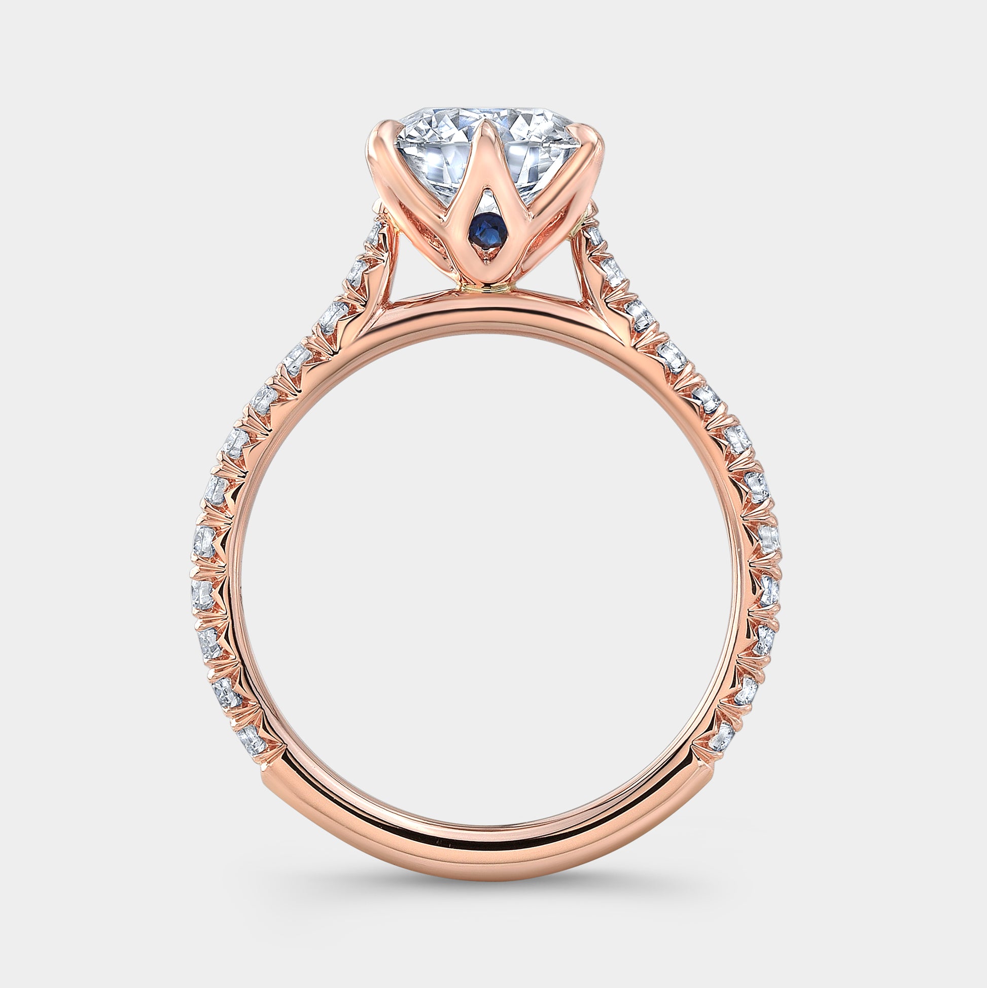 Rose gold round ring, tulip pave with hidden gem.