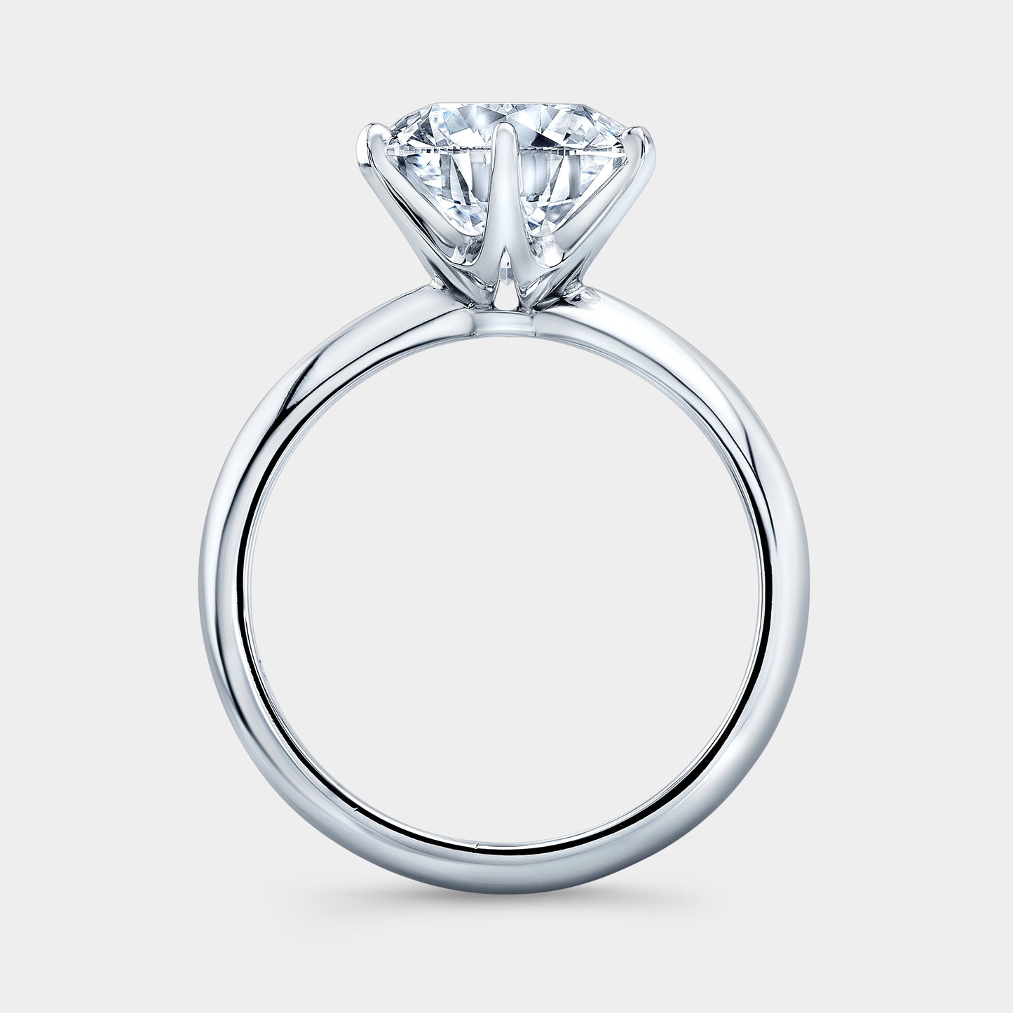 Platinum round ring, London knife edge solitaire.