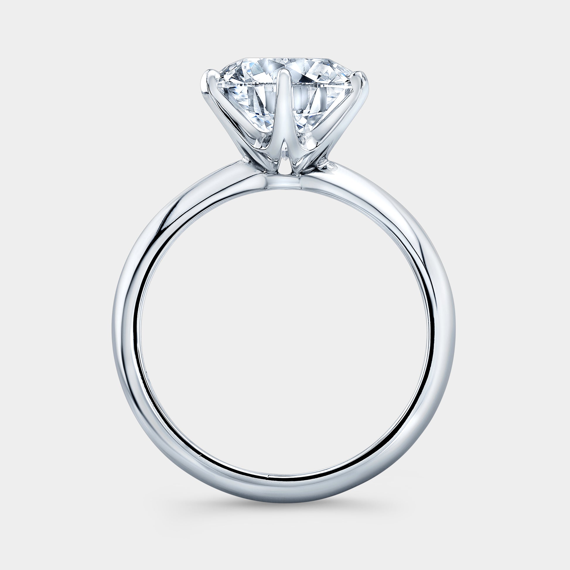 Platinum round ring, London knife edge solitaire.