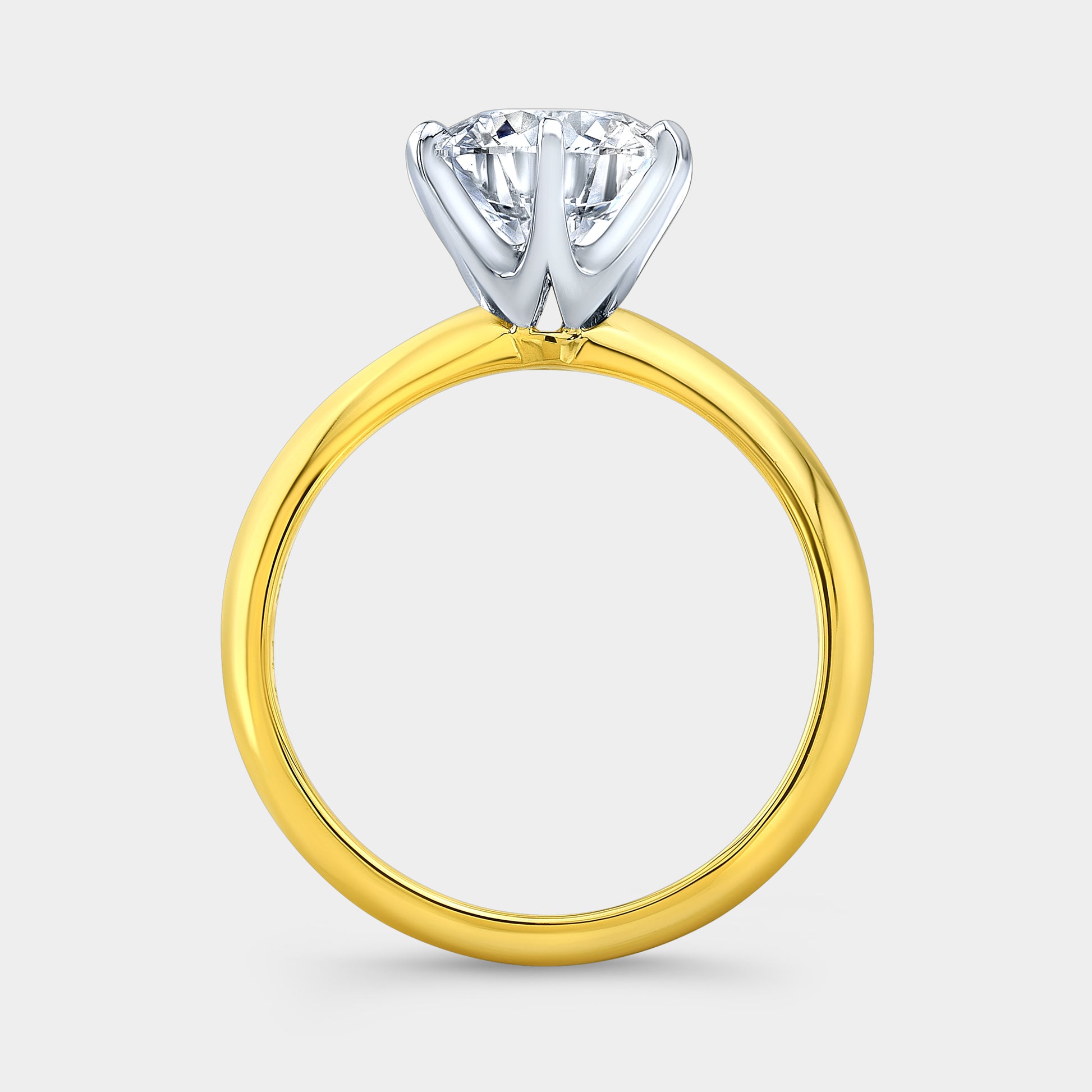 Two tone round ring, London knife edge solitaire.