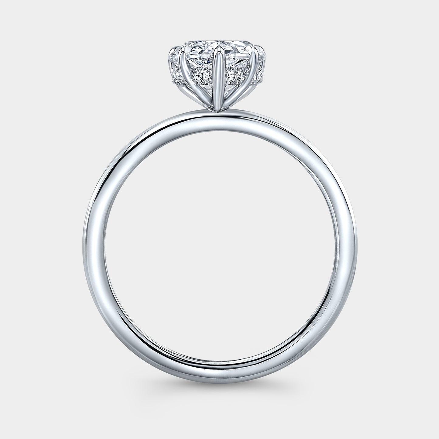 White gold pear ring, hidden halo, solitaire setting.