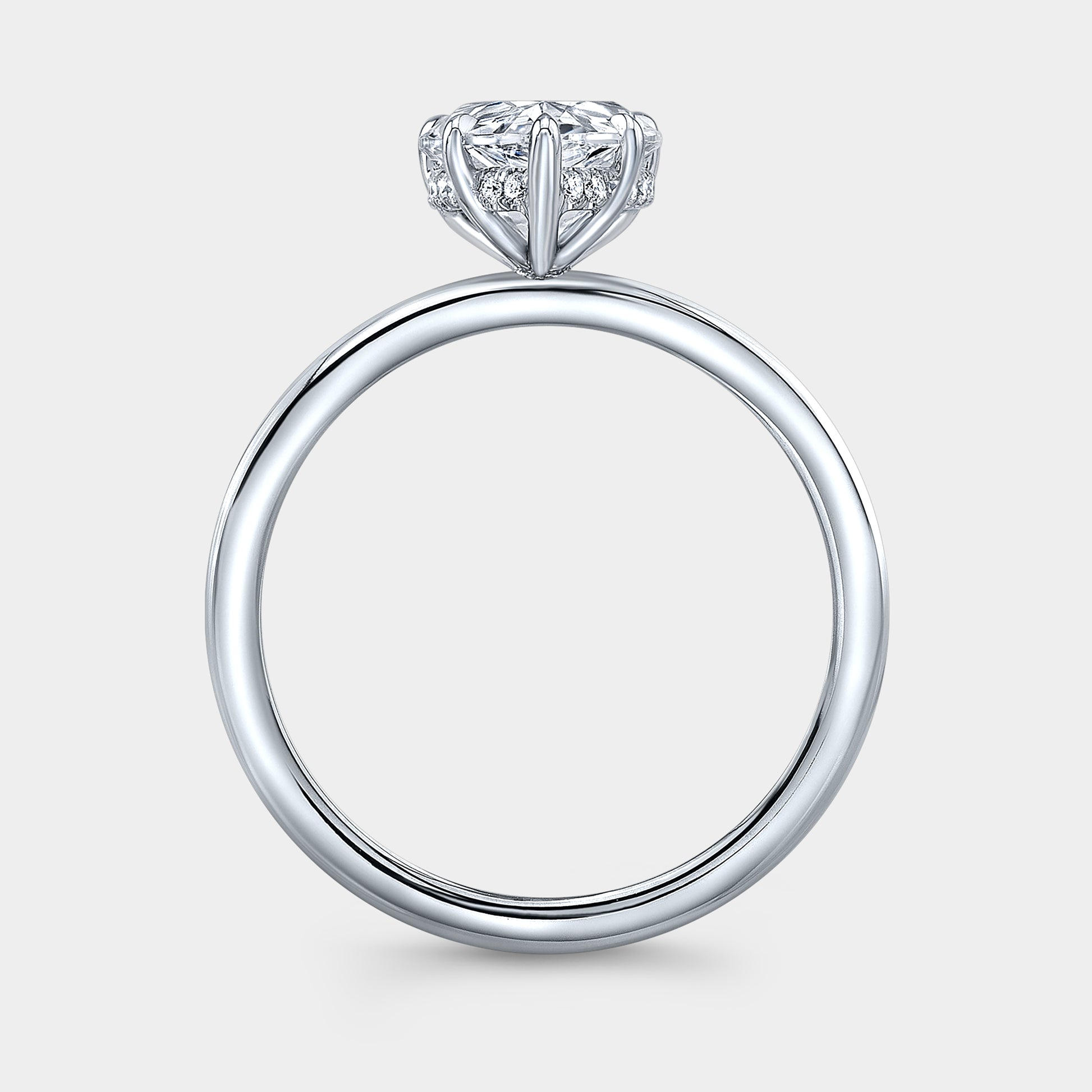 White gold pear ring, hidden halo, solitaire setting.