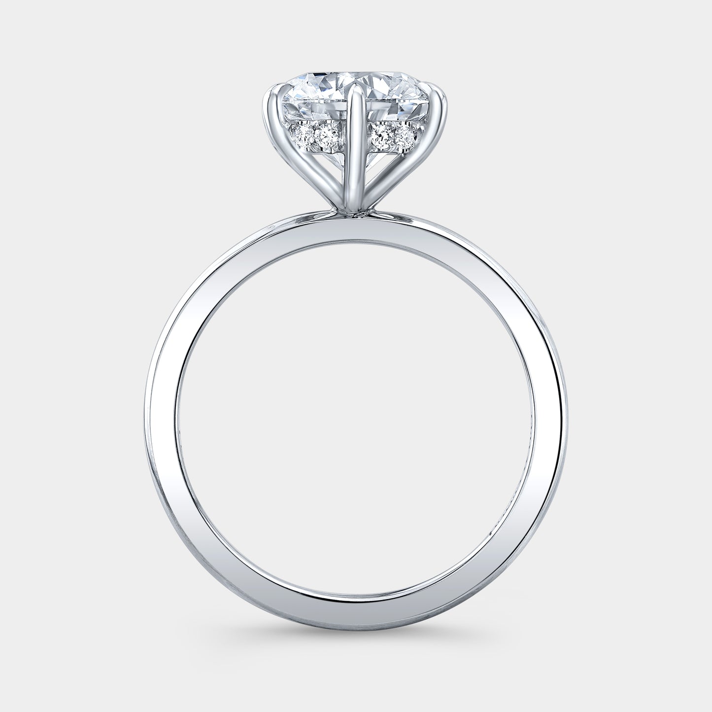 Platinum round ring, hidden halo, solitaire setting.
