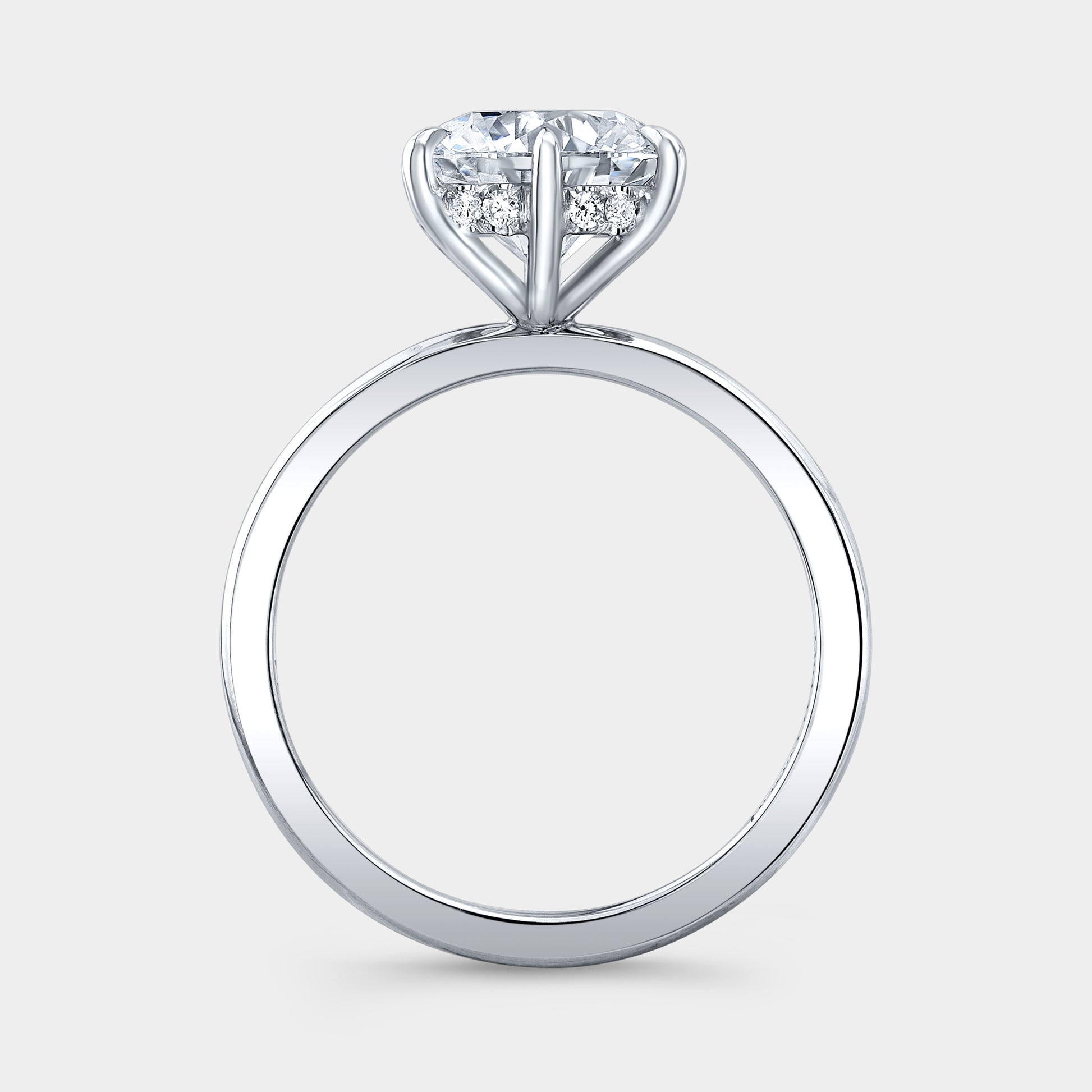 Platinum round ring, hidden halo, solitaire setting.