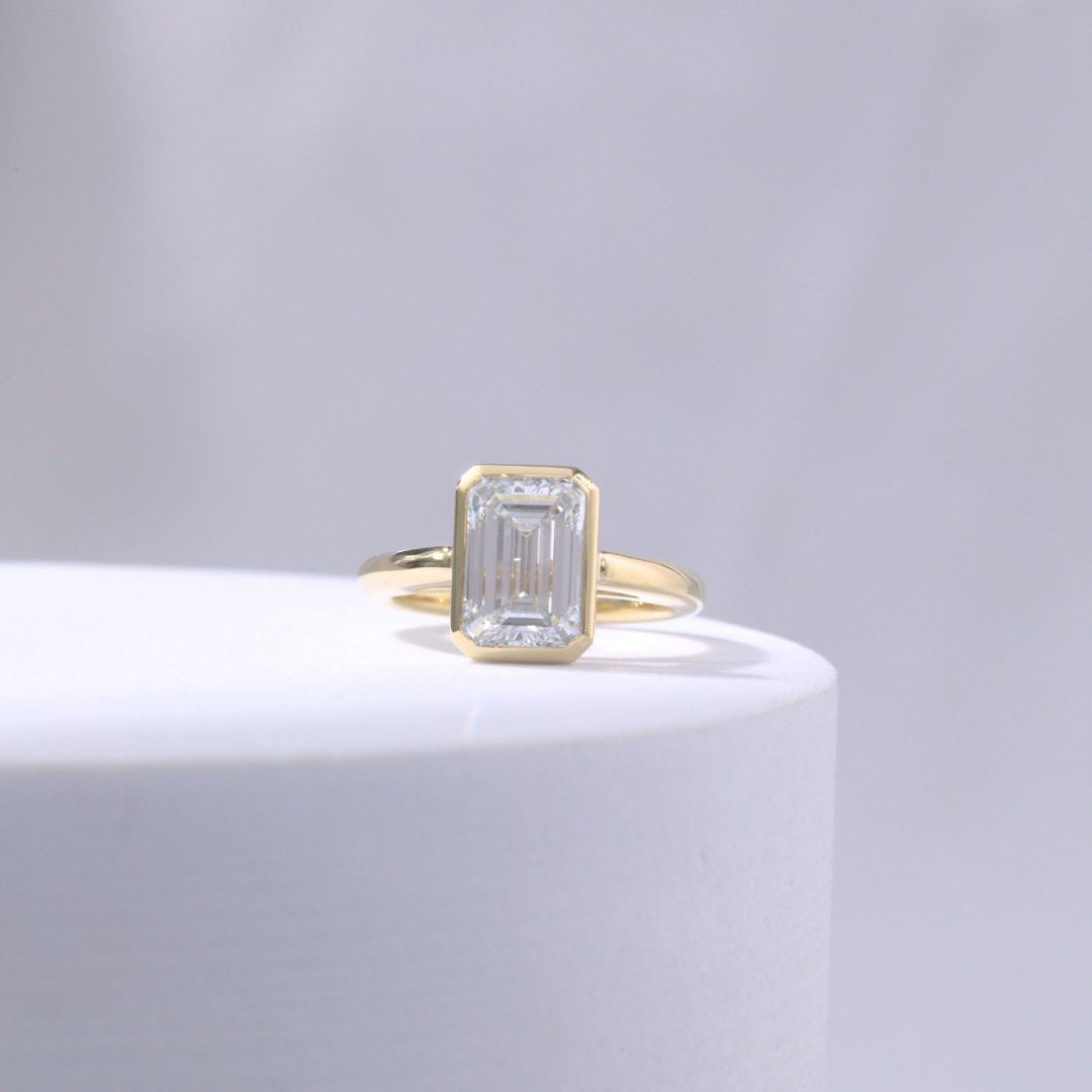Emerald Diamond Mira Bezel Solitaire Cathedral Yellow Gold Engagement Ring