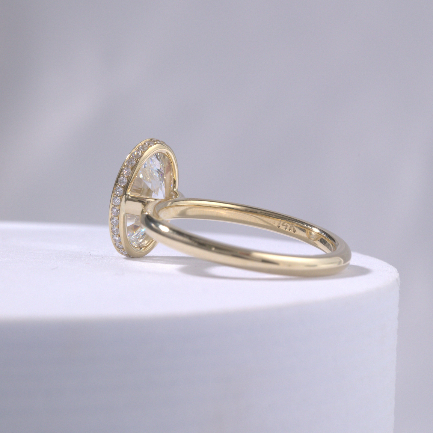 Oval Diamond Hidden Halo Bezel Set Solitaire Yellow Gold Engagement Ring