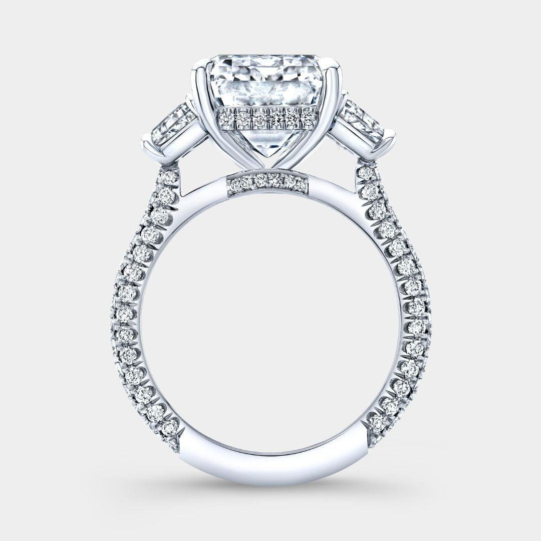 By Bonnie platinum engagement ring with emerald-cut diamonds, hidden halo, and pavé details