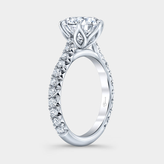 Round diamond ring, cathedral tulip setting, French pave band.