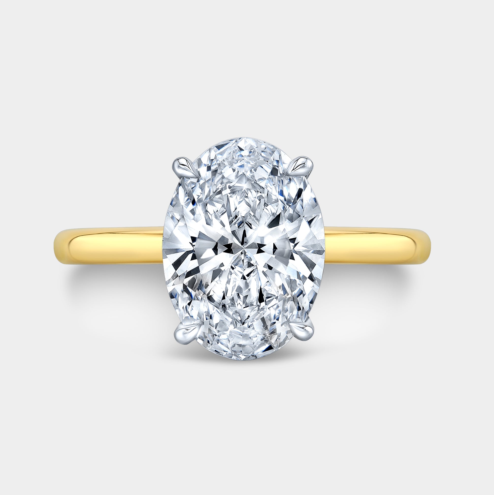 Two tone oval ring, top view, tulip solitaire.