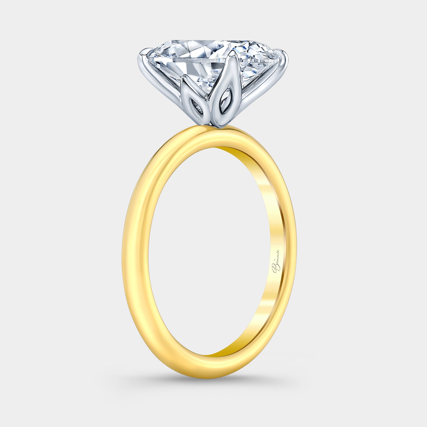 Two tone diamond ring on hand, oval tulip.