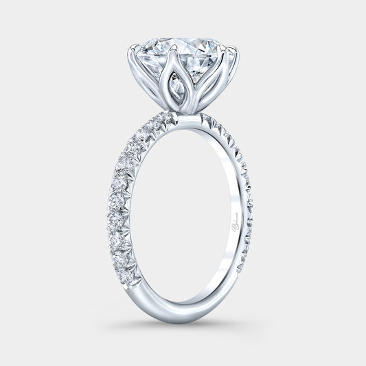 Round diamond ring, tulip setting, French pave band.