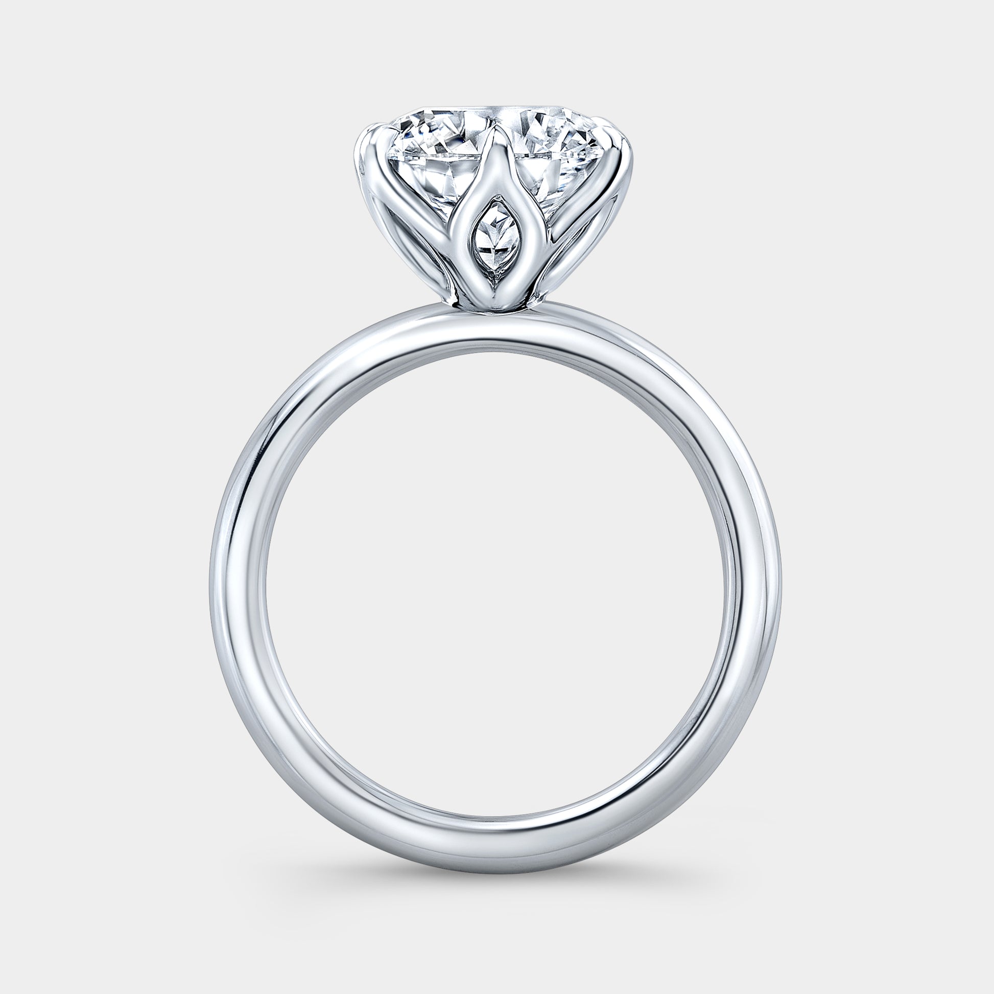 Round solitaire ring, platinum, tulip setting.