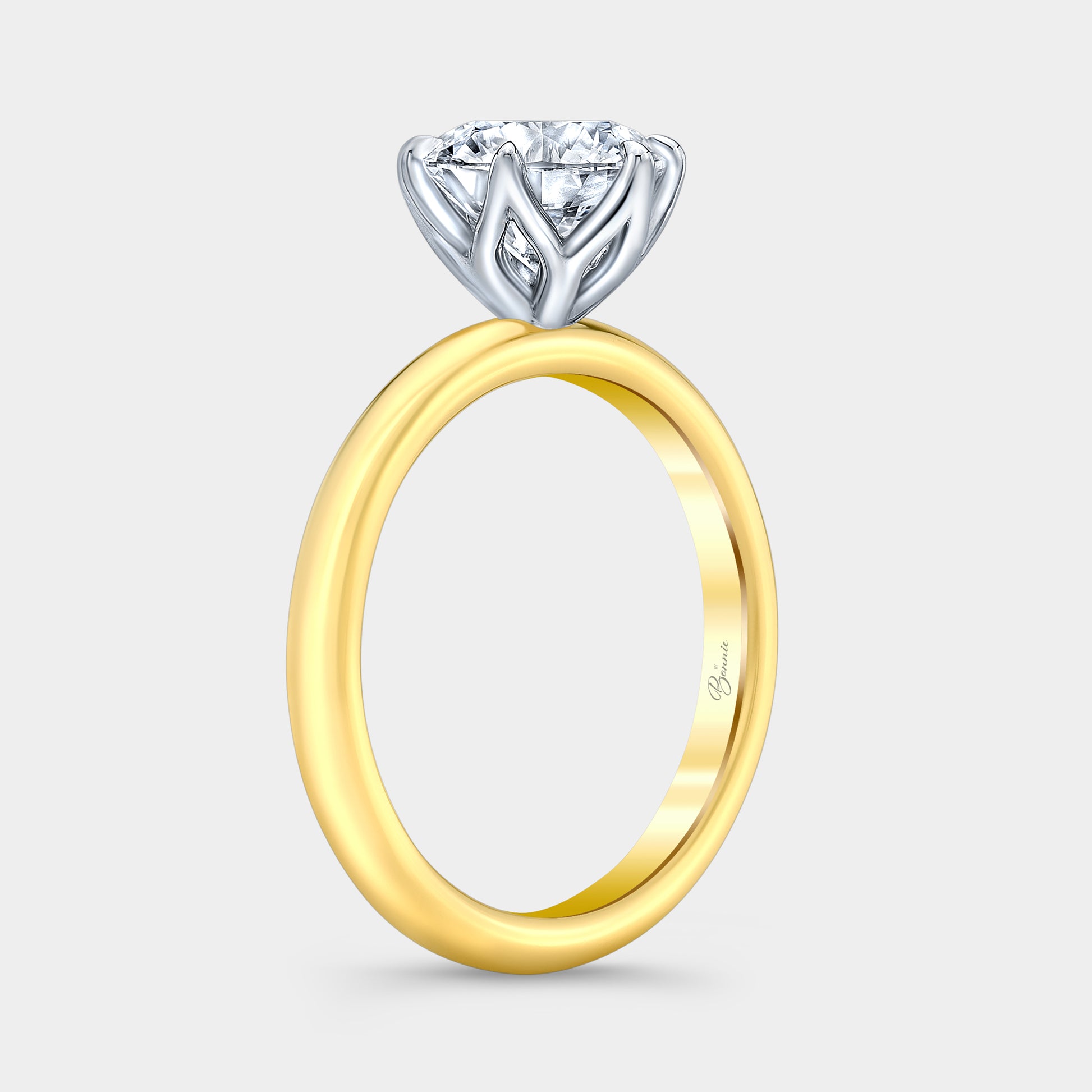 Two tone diamond ring on hand, round tulip.