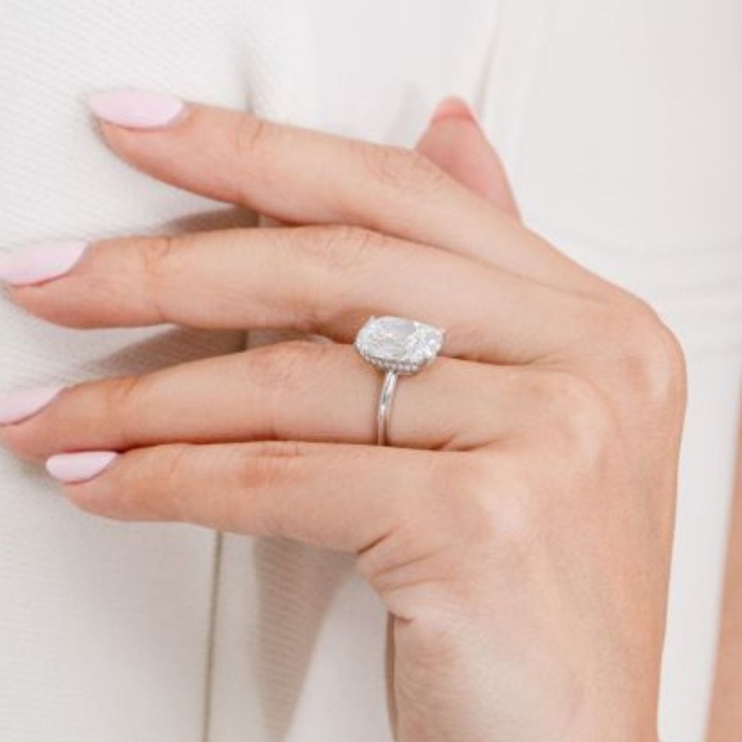 Diamond ring on hand, size shown.