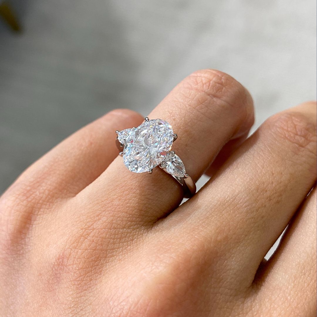 Oval Diamond with Heart Shape Diamond 3 Stone Platinum Engagement Ring