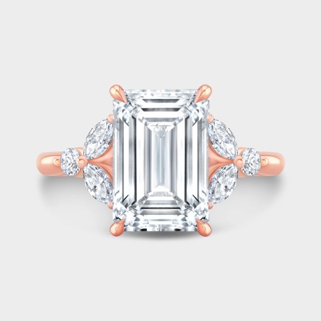 Emerald diamond halo ring, rose gold.
