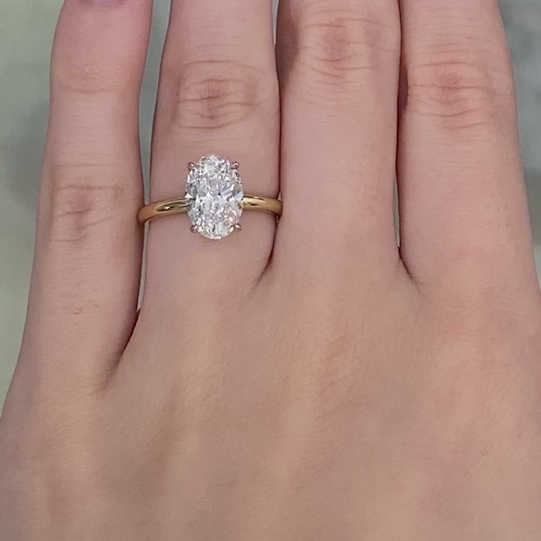 Oval ring video, worn on hand, solitaire setting.