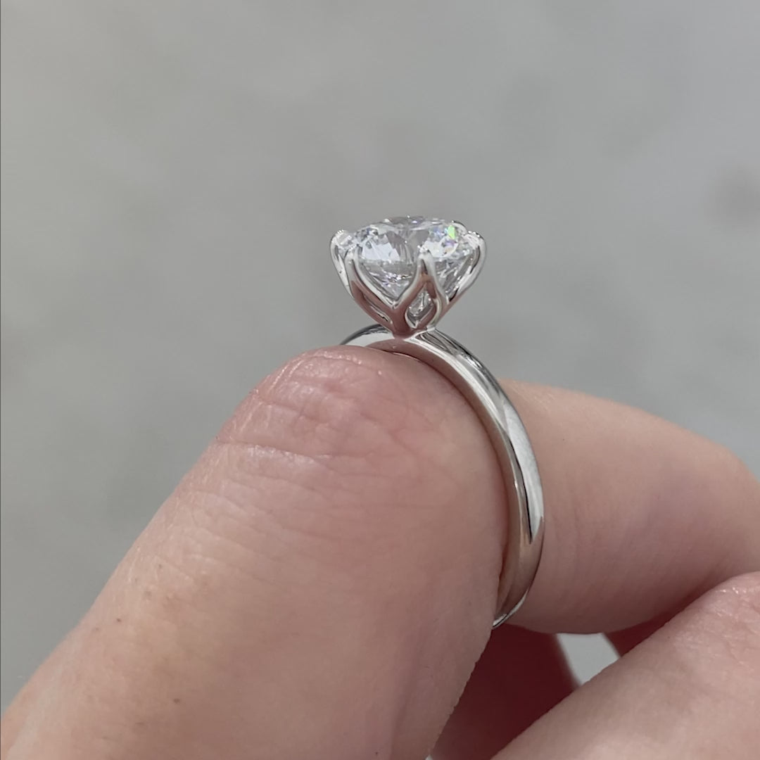 Round ring video, worn on hand, tulip setting.