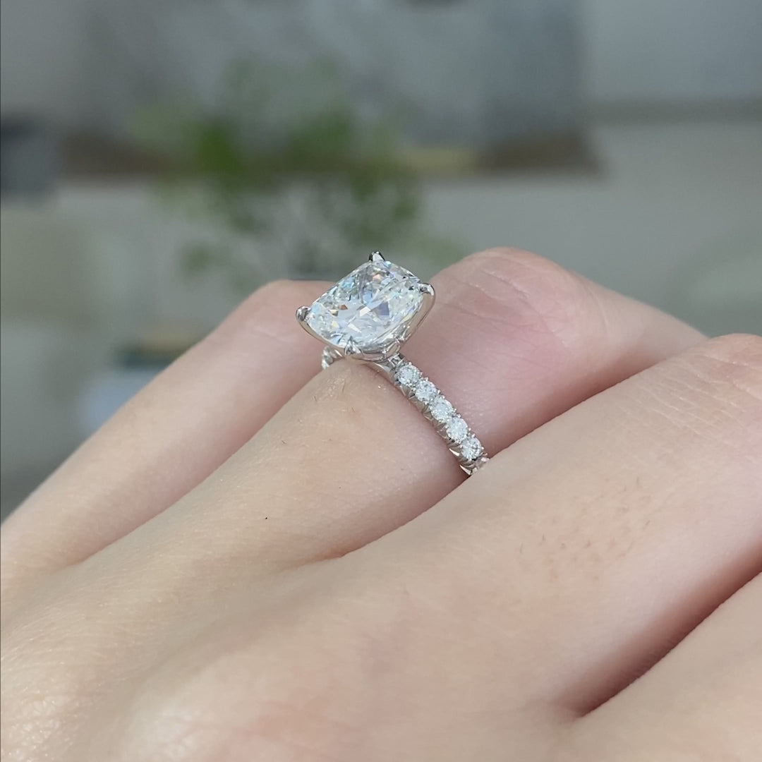 Video of a 2.50ct cushion diamond engagement ring with tulip setting and French pave.