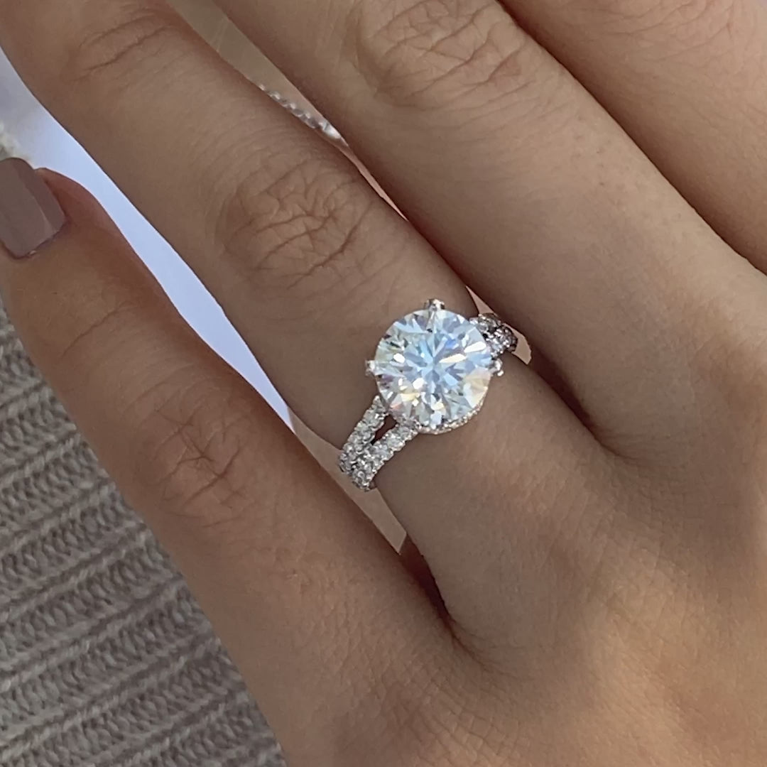 White gold ring video, round diamond, pave details, and 4 prong setting.