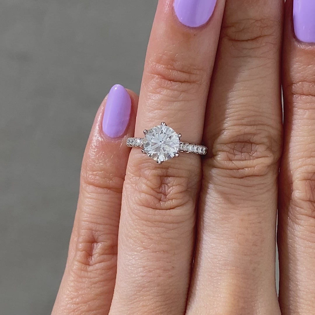 Round ring video, worn on hand, tulip pave setting.