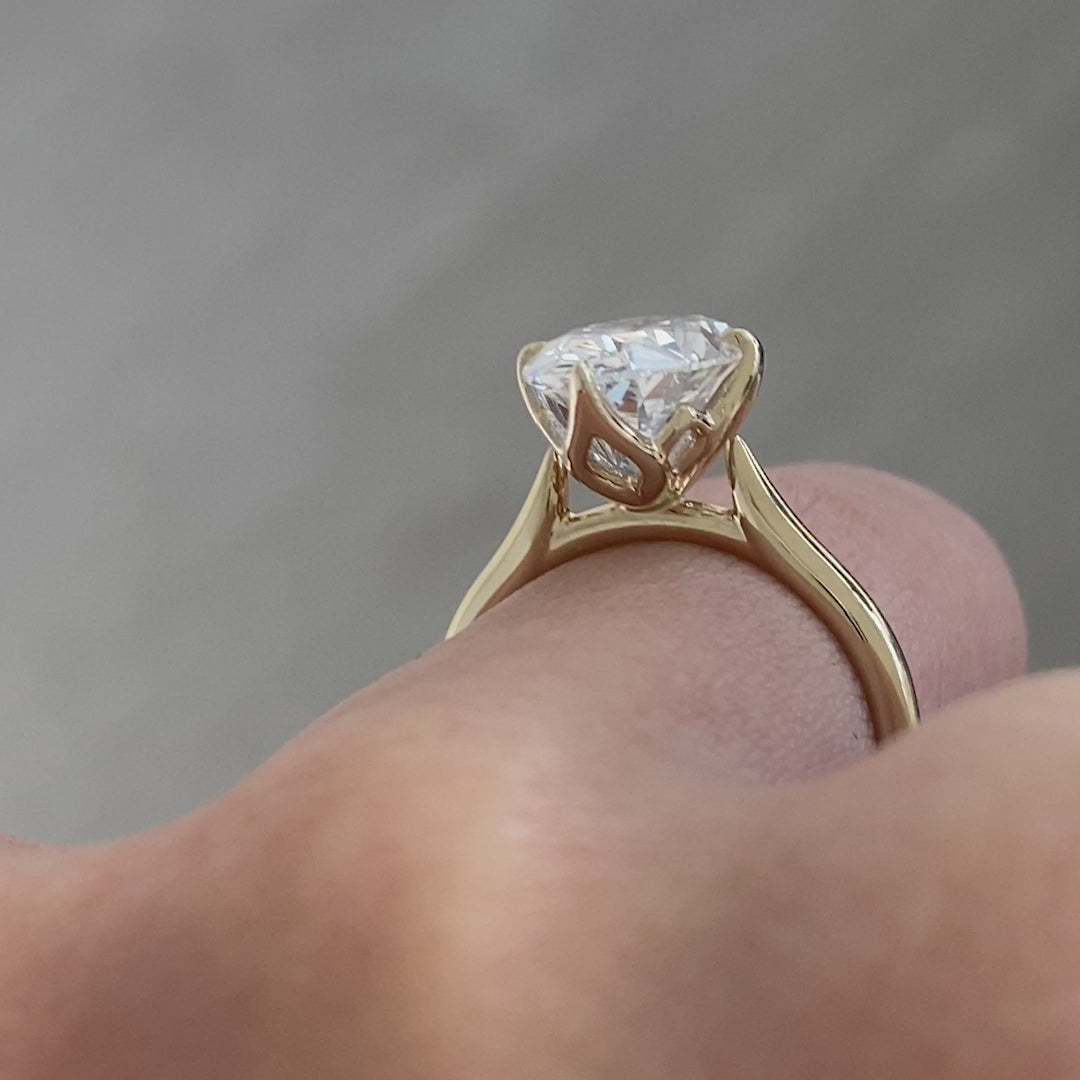 Oval ring video, worn on hand, tulip setting.