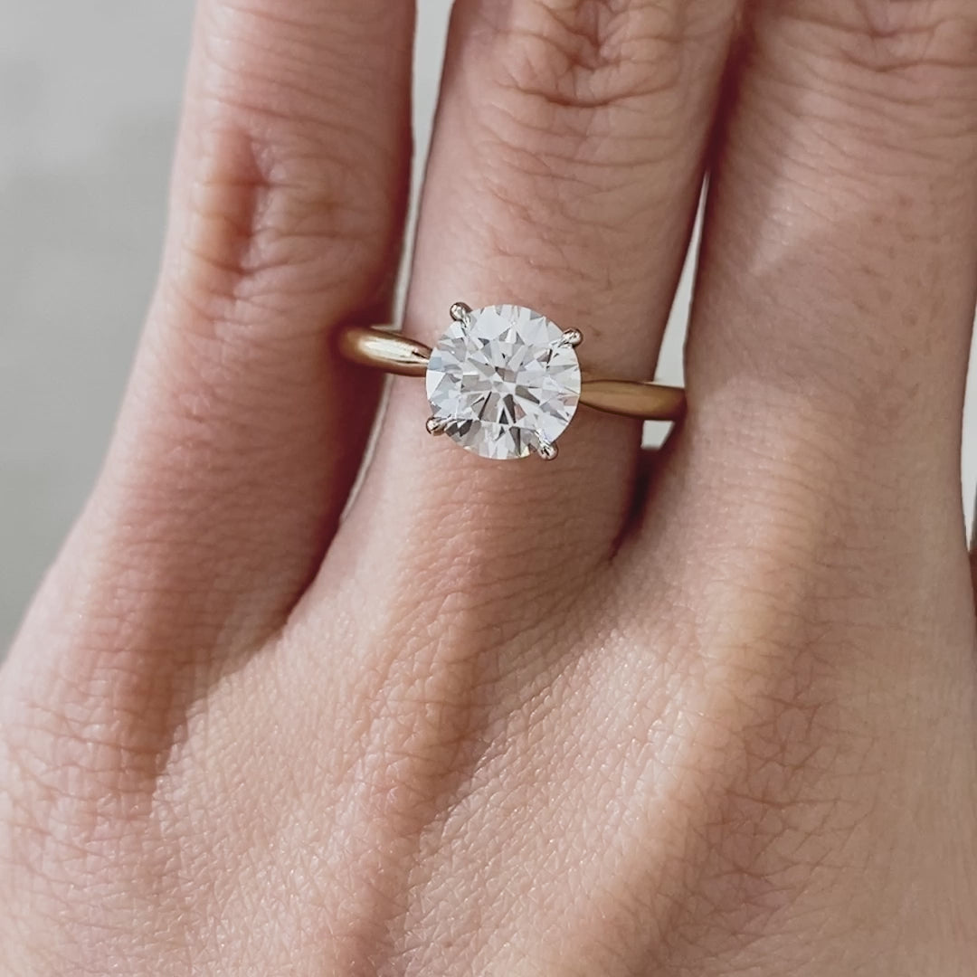 Round ring video, worn on hand, solitaire setting.