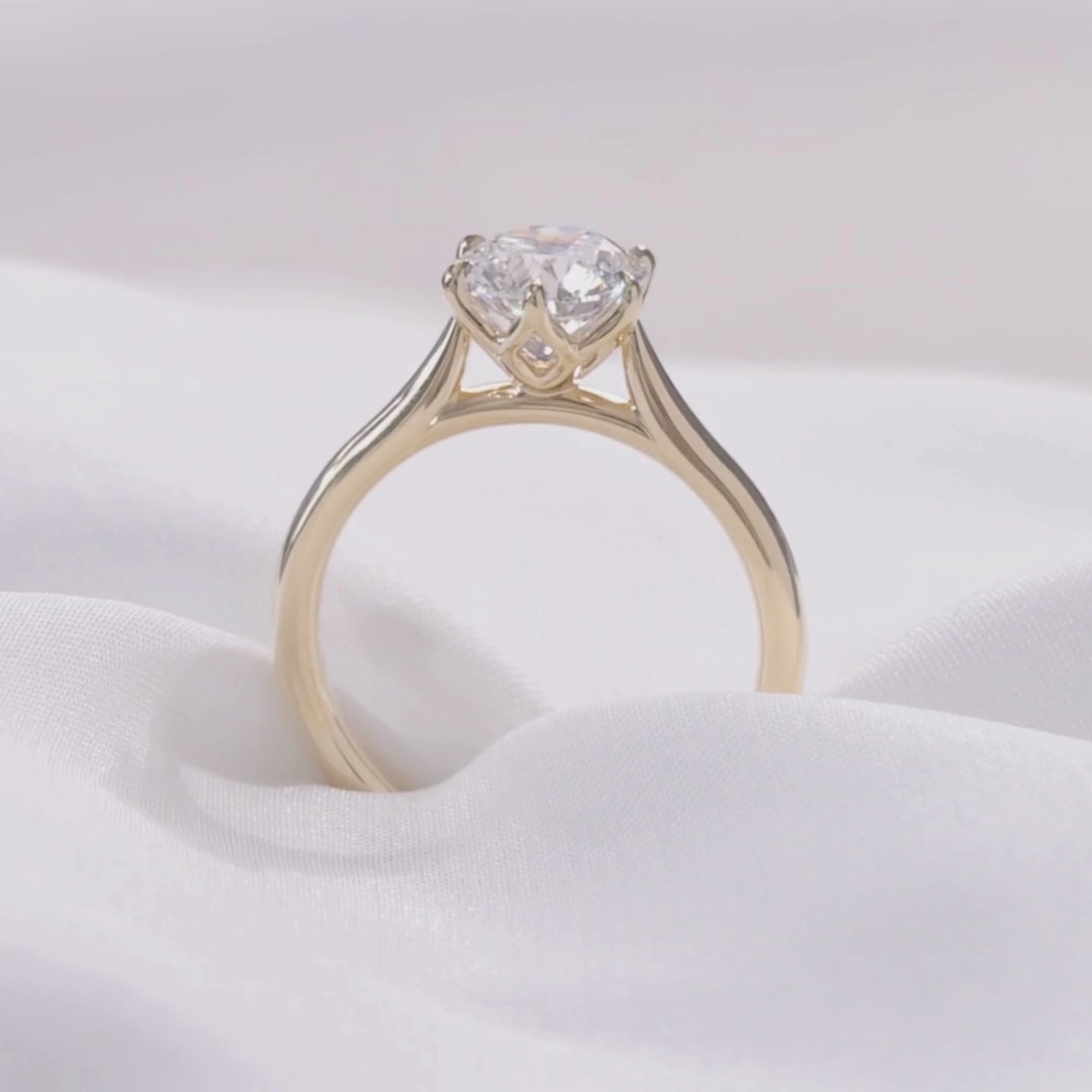 Round ring video, worn on hand, tulip setting.