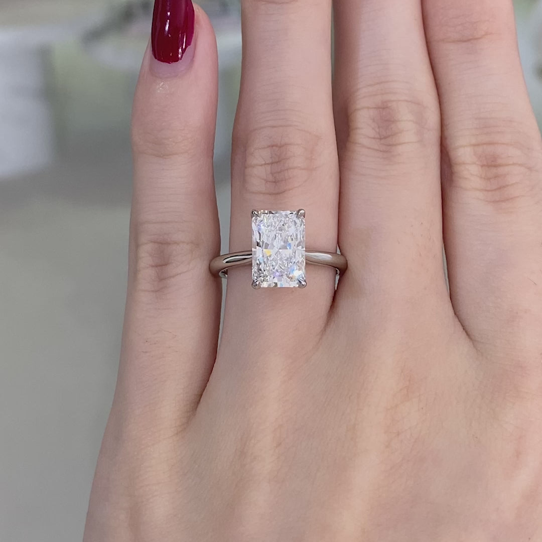 Video of a 3ct radiant diamond engagement ring with tulip setting and low tapered cathedral design.