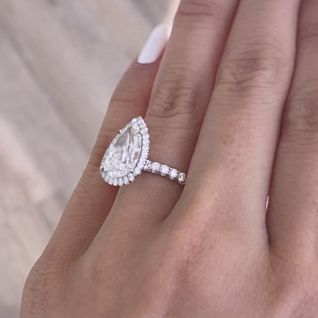 Video of a 3.50ct pear diamond engagement ring with halo and U pave setting