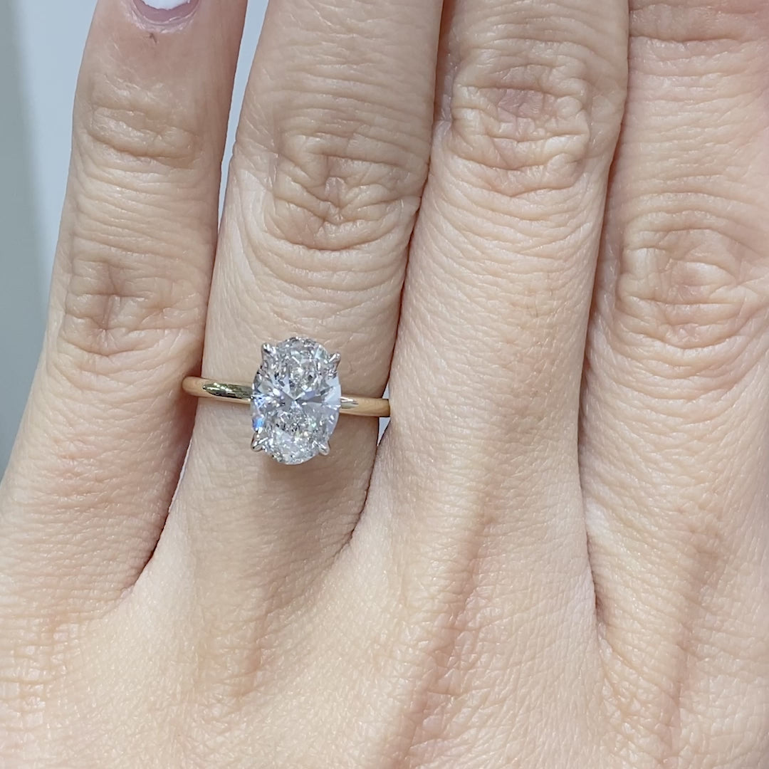 Oval ring video, worn on hand, tulip setting.