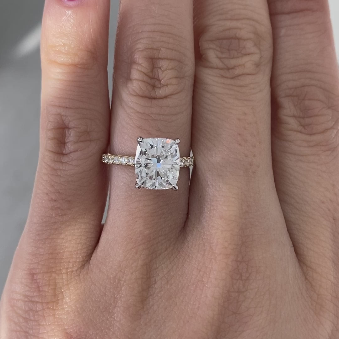 Cushion ring video, worn on hand, tulip pave setting.