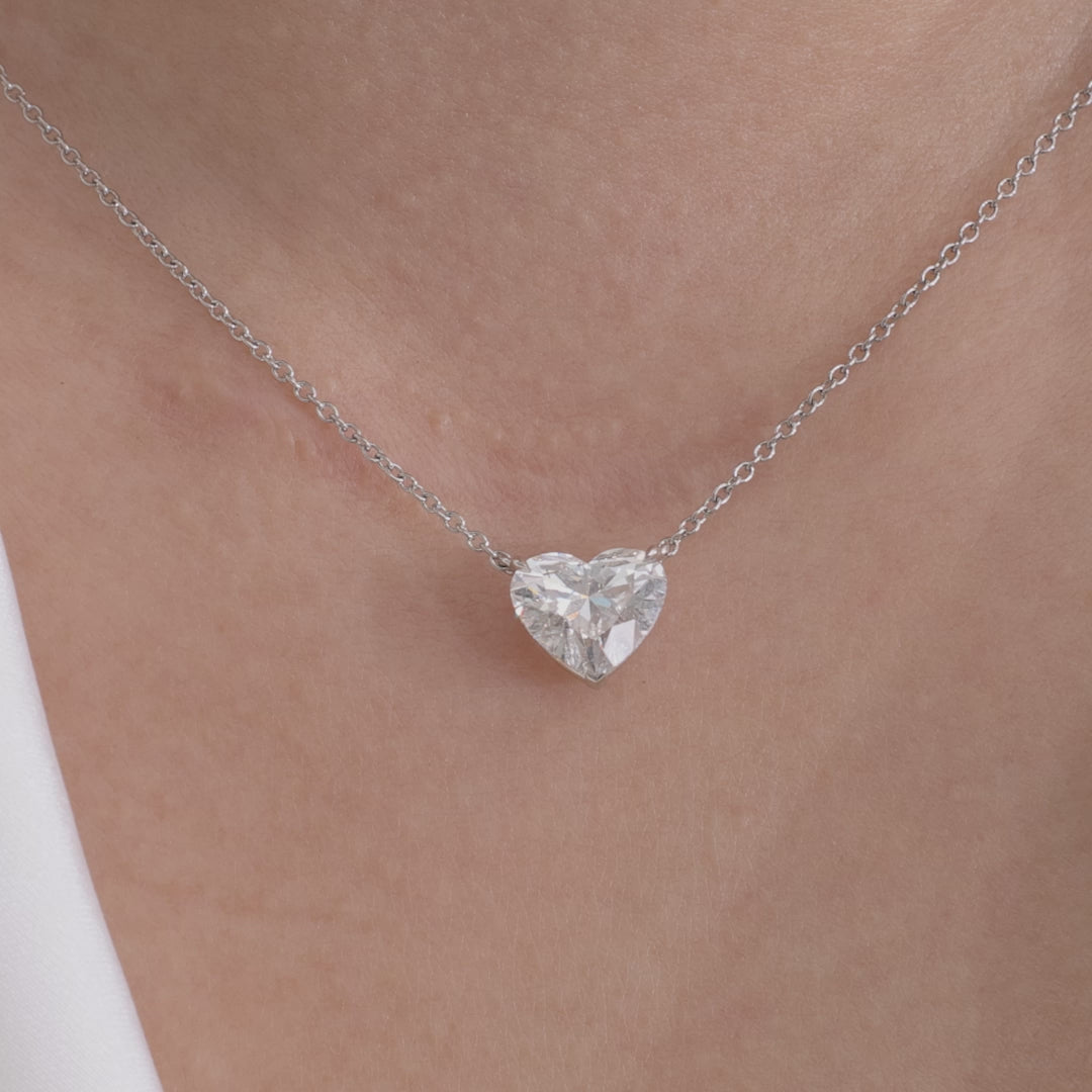 Platinum necklace video, heart diamond pendant, and solitaire setting.
