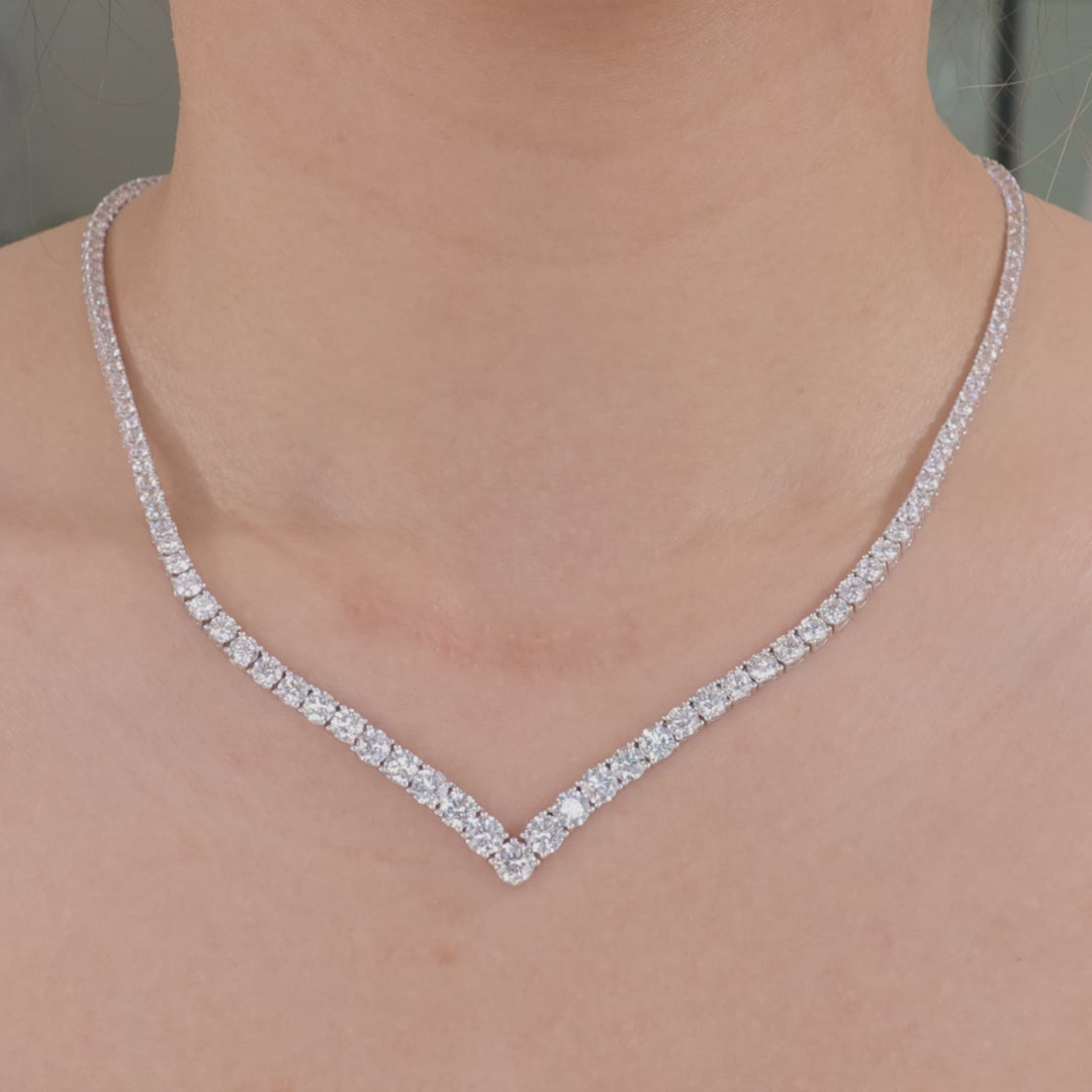 Video of a 16.25ct round lab grown diamond chevron white gold tennis necklace.