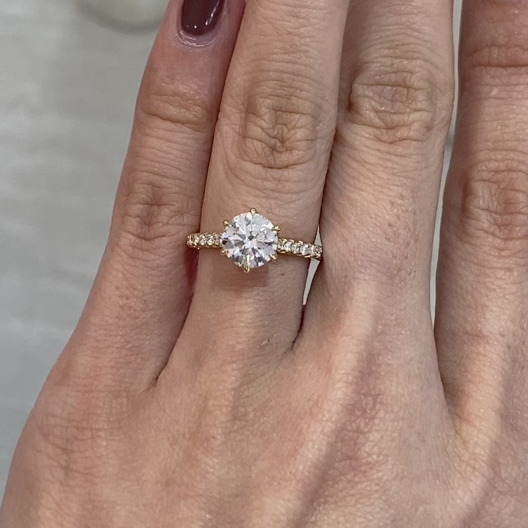 Round ring video, worn on hand, tulip pave setting.