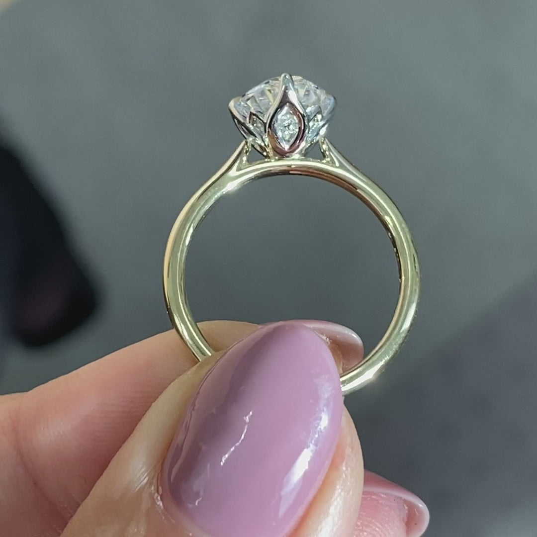 Oval ring video, worn on hand, tulip setting.