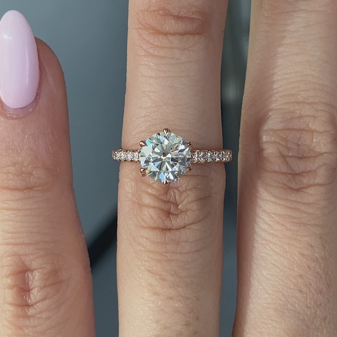 Round ring video, worn on hand, tulip pave setting.