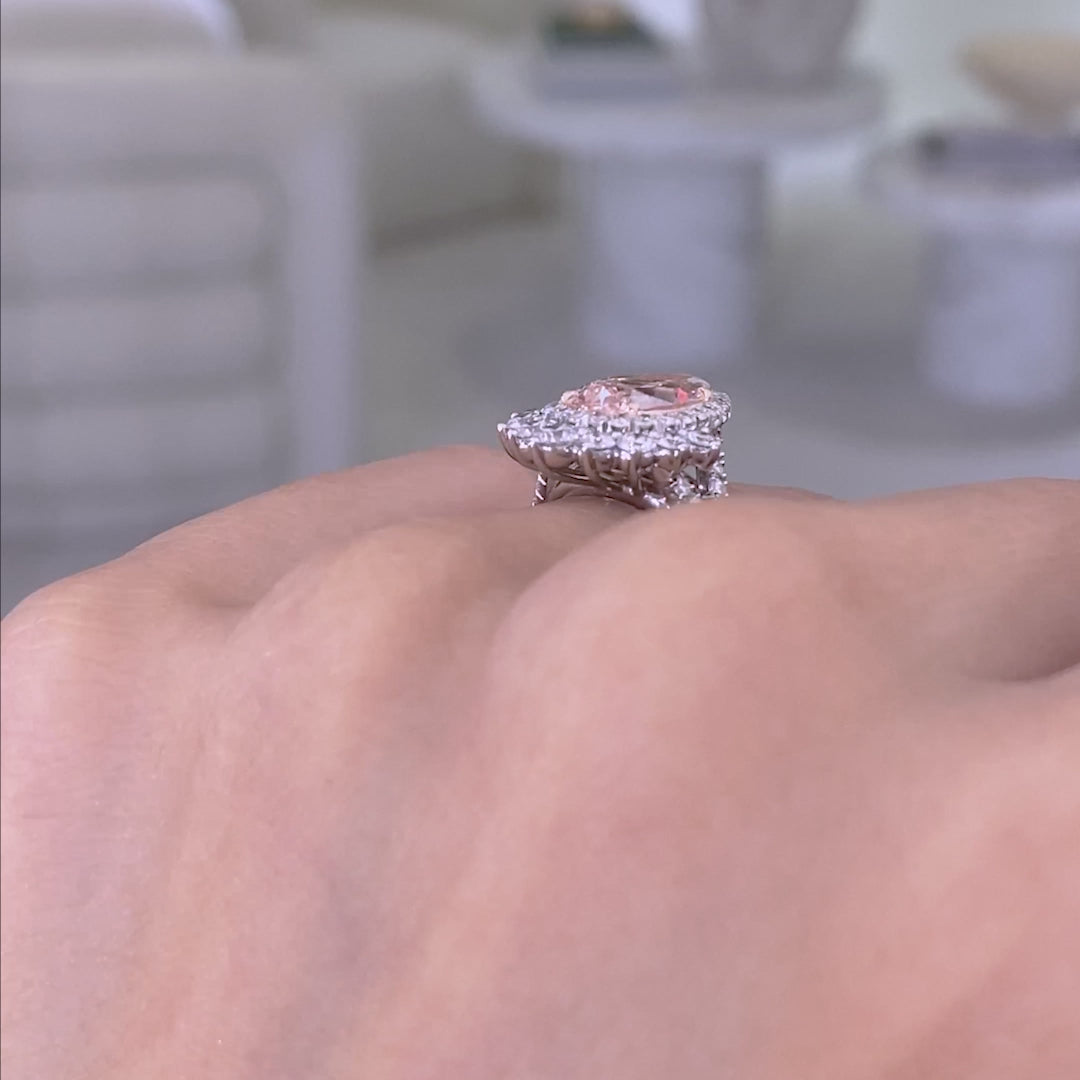 Pink pear ring video, worn on hand, pave twist.