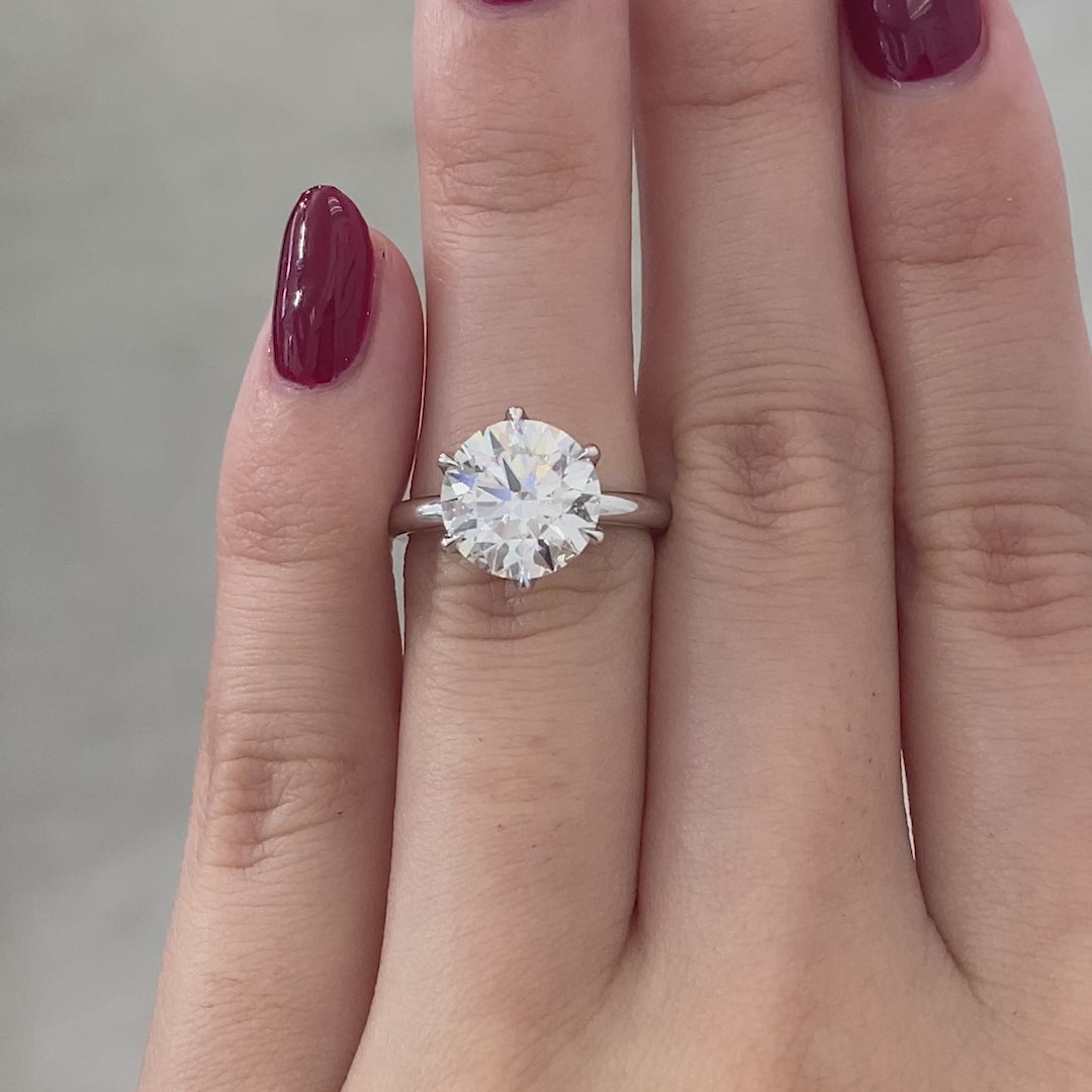 White gold ring video, round diamond, tulip basket, and full diamond details.