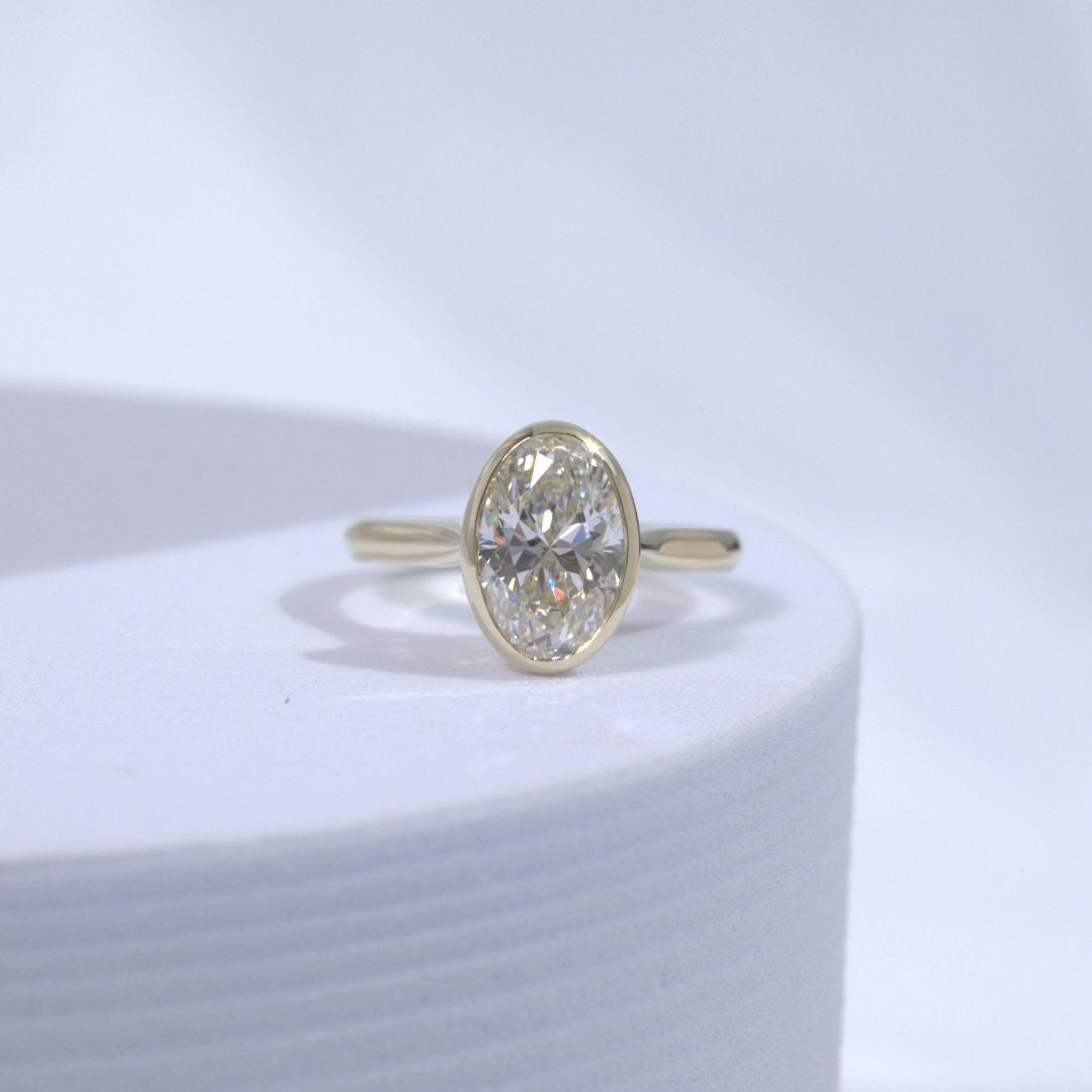 Oval Diamond Bezel Set Tulip Basket Tapered Cathedral Solitaire Yellow Gold Engagement Ring