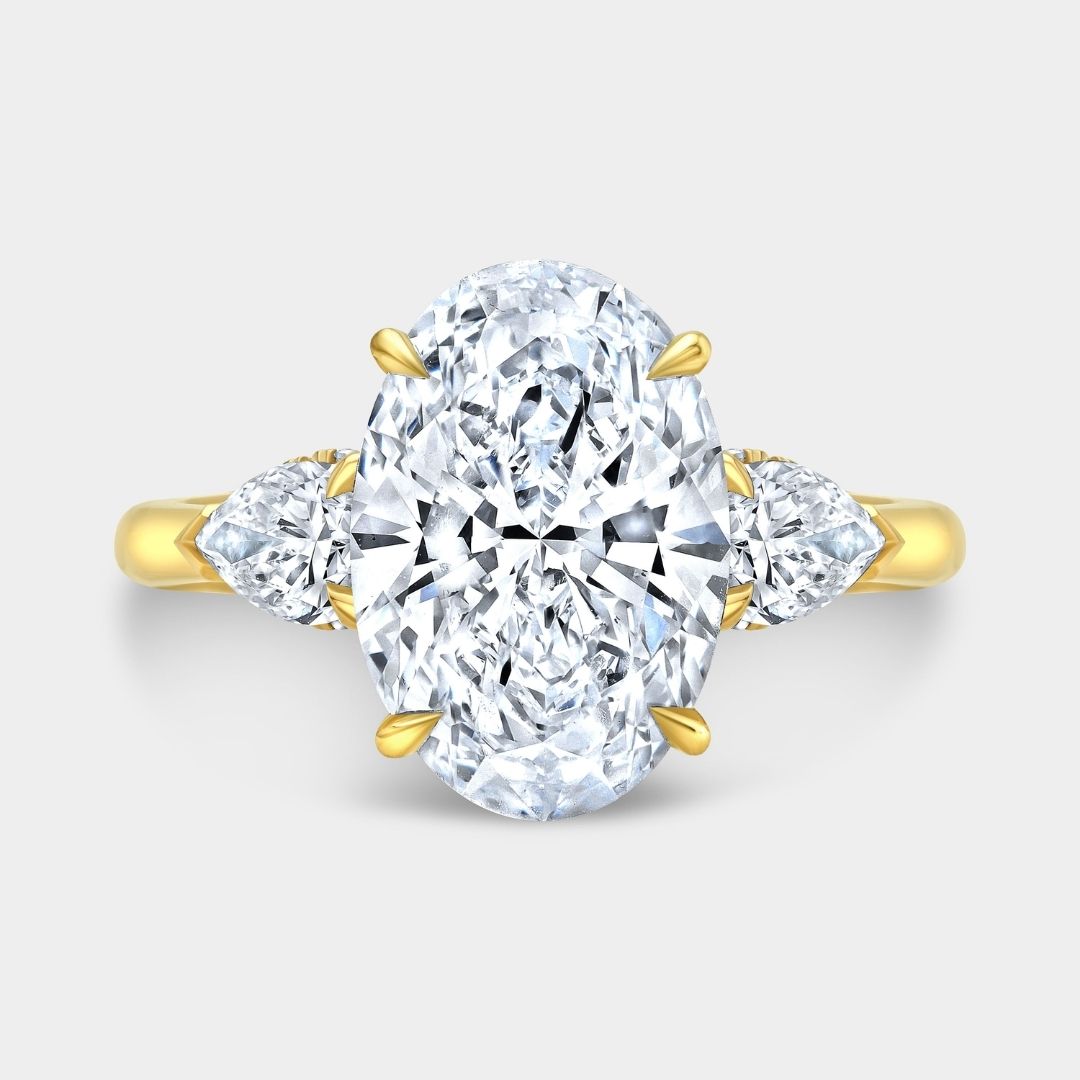 Oval Diamond Hidden Halo with Pear Shape Side Stones Yellow Gold Engagement Ring