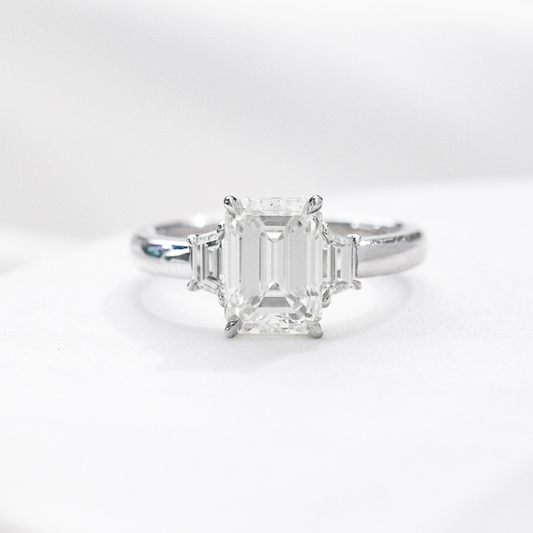 2.06ct lab grown emerald cut diamond 3 stone platinum engagement ring with trapezoid sides
