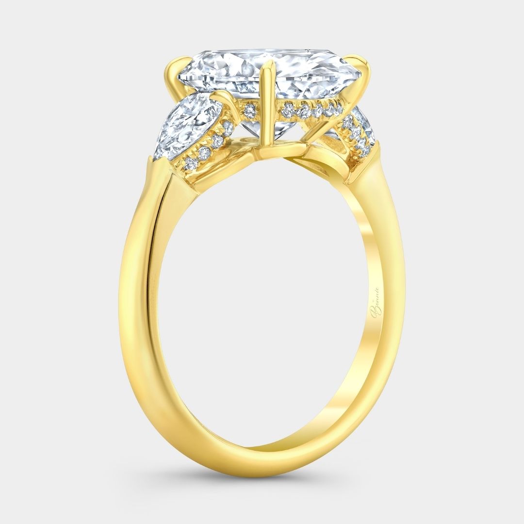 Oval Diamond Hidden Halo with Pear Shape Side Stones Yellow Gold Engagement Ring