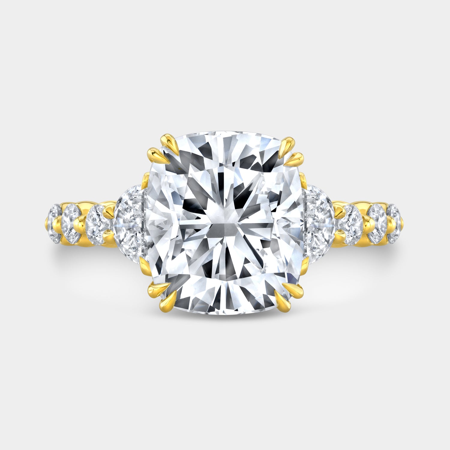 Yellow gold cushion diamond ring, top view, hidden halo.