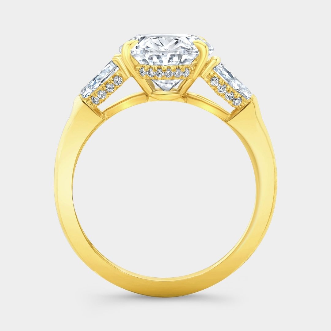 Oval Diamond Hidden Halo with Pear Shape Side Stones Yellow Gold Engagement Ring