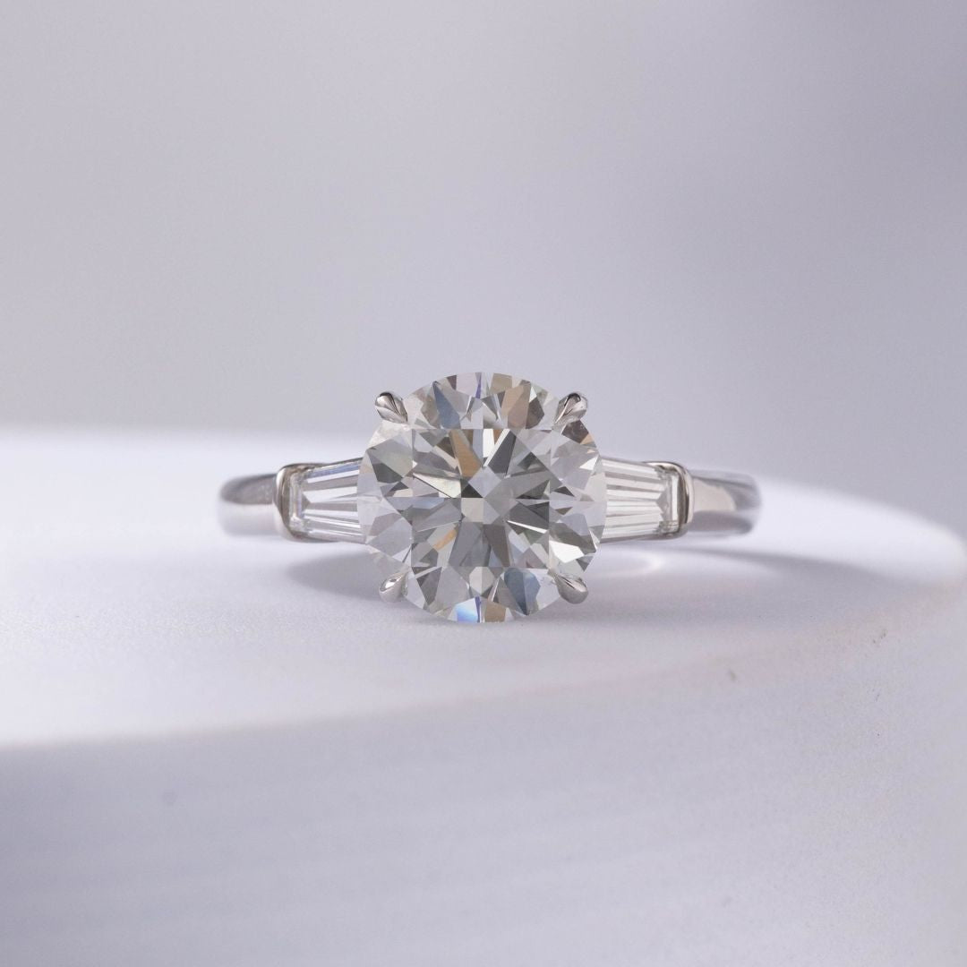 Round Diamond 3 Stone Ring with Tapered Baguette Side Stones Platinum Engagement Ring