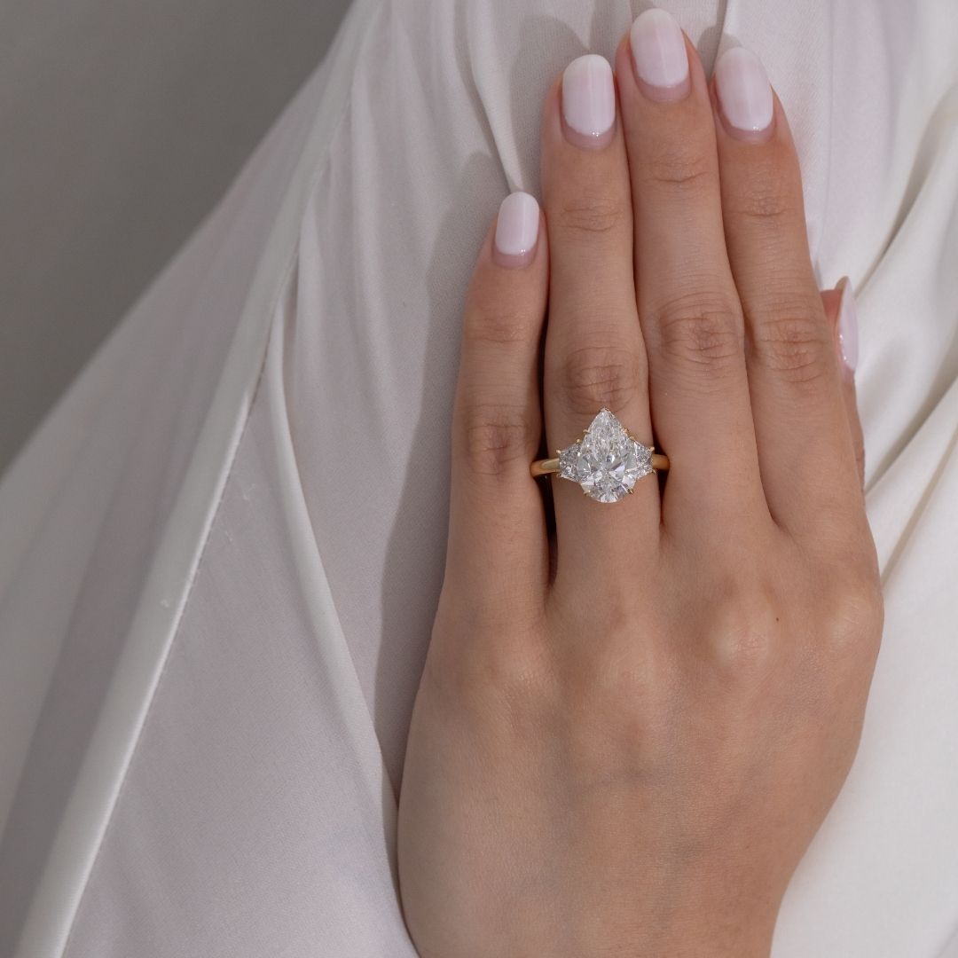 4ct Pear Shape Diamond with Trapezoid Yellow Gold 3 Stone Ring