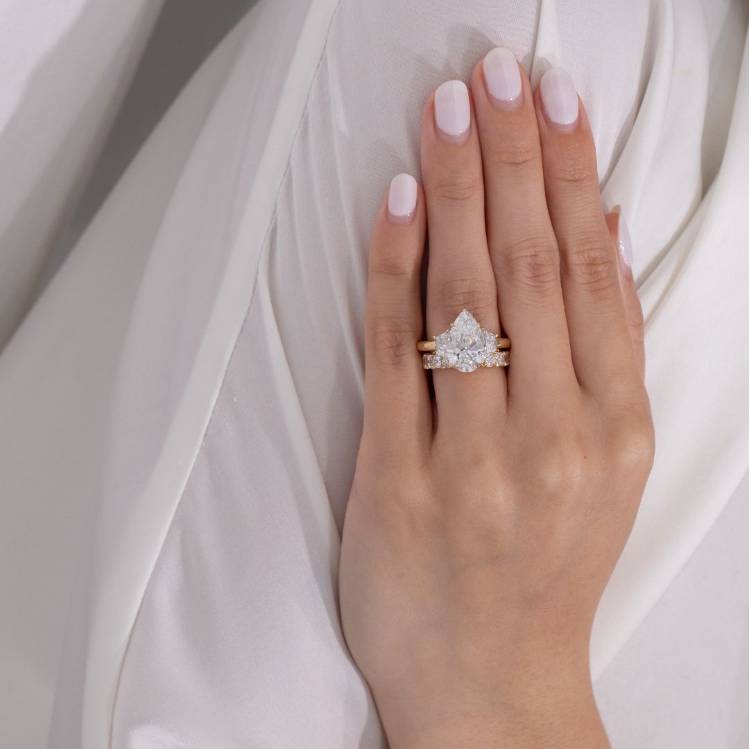 4ct Pear Shape Diamond with Trapezoid Yellow Gold 3 Stone Ring